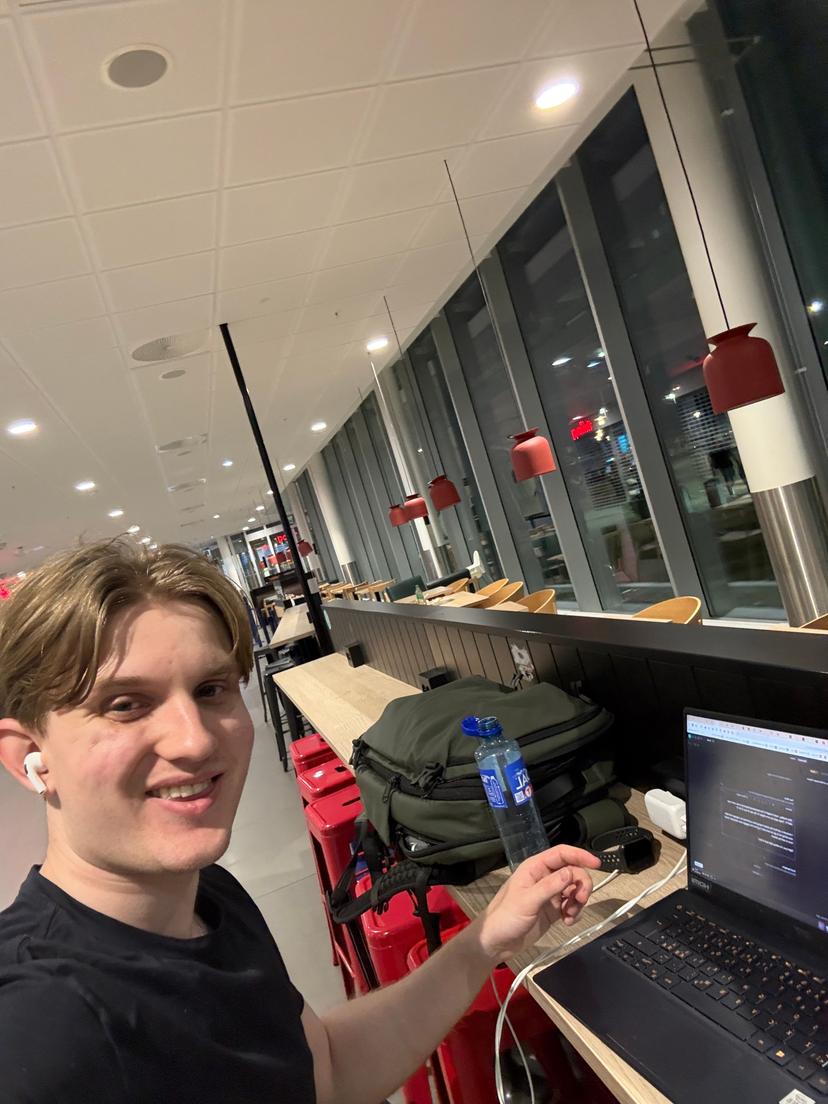 Me sitting in airport working on laptop